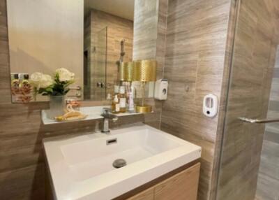 Modern bathroom with sink, mirror, and shower