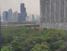 View of cityscape with green space and tall buildings