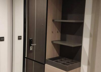 Modern hallway with mirror and storage units