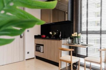 Modern kitchen area with a small dining space