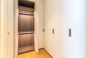 Spacious walk-in closet with open shelving