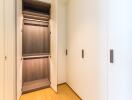 Spacious walk-in closet with open shelving