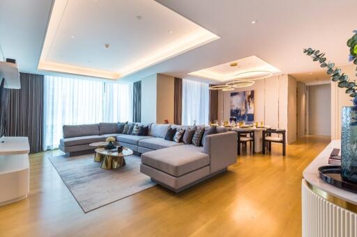 Modern spacious living room with sectional sofa and dining area