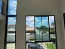 Spacious living room with large windows and natural light