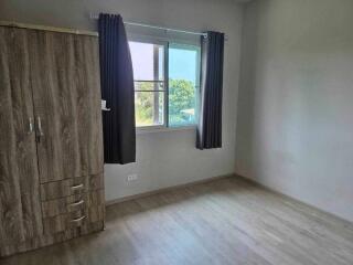 Bedroom with wardrobe and window