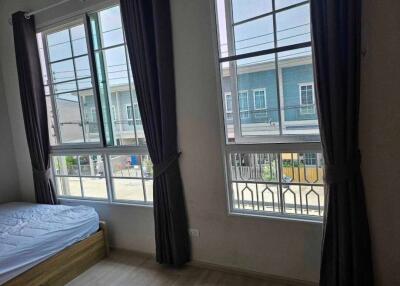 Bedroom with large windows and natural light