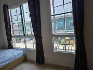 Bedroom with large windows and natural light