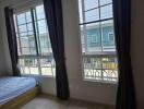 Bedroom with large windows and natural light