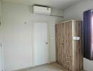 Bedroom with wardrobe and air conditioning