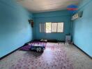 Bedroom with blue walls and windows