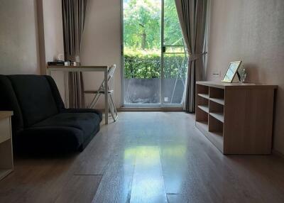 Living room with large window and natural light