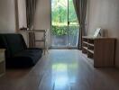 Living room with large window and natural light