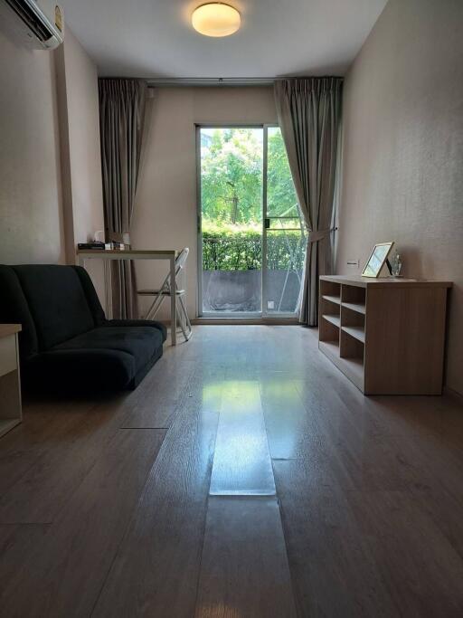 Living room with large window and natural light