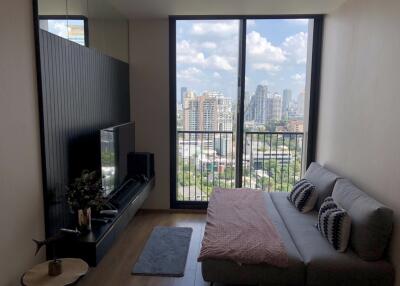 Living room with large window and city view