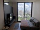 Living room with large window and city view