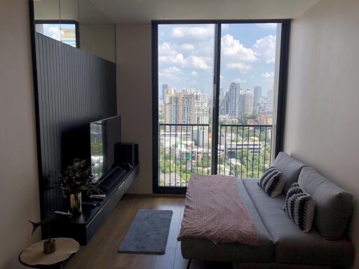 Living room with large window and city view