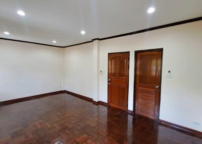 Spacious living room with wooden flooring