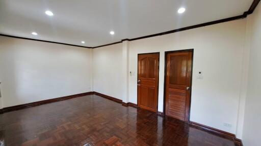 Spacious living room with wooden flooring