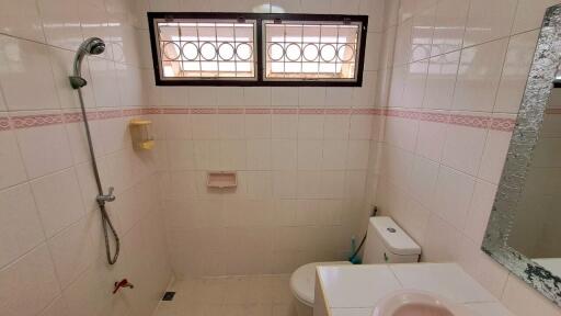 Bathroom with shower, toilet, and sink