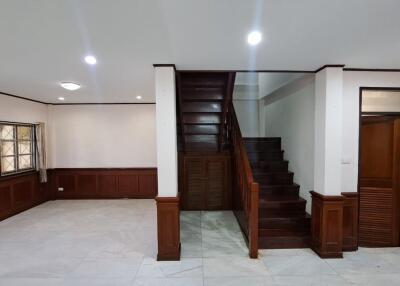 Spacious living room with staircase