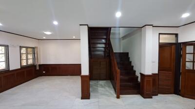 Spacious living room with staircase