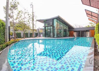 Modern building with adjacent outdoor swimming pool