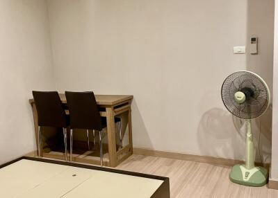 Dining area with air conditioning, table, chairs, and fan