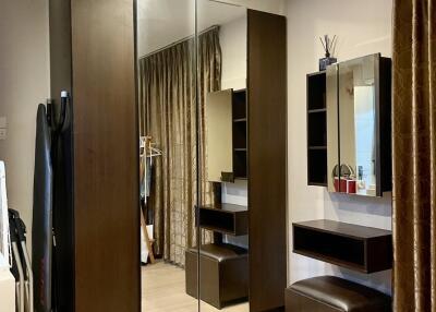 Bedroom with mirror wardrobe and vanity area