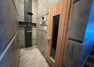 Bathroom with shower and sauna