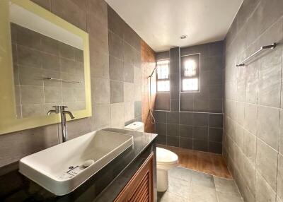 Modern bathroom with large sink and walk-in shower