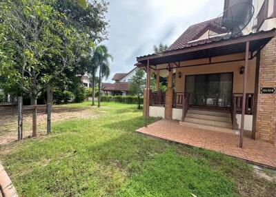 Front view of a house with a lawn and porch