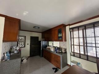 Spacious kitchen with wooden cabinets