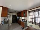 Spacious kitchen with wooden cabinets