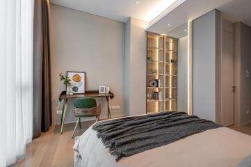 Modern bedroom with wooden desk and shelf