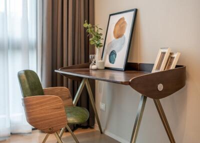 Home office with wooden desk and chair