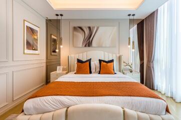 Modern bedroom with elegant décor and warm colors