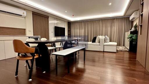 Modern living room with dining area and wooden floors