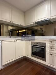 Modern kitchen with beige cabinetry and stainless steel appliances