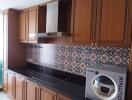 Modern kitchen with wooden cabinets and patterned backsplash