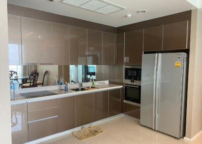 Modern kitchen with glossy cabinetry and built-in appliances