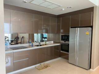 Modern kitchen with glossy cabinetry and built-in appliances