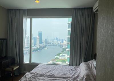 Bedroom with a view of the city