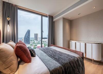 Modern bedroom with large window and city view