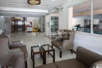 Comfortable lobby area with seating space and glass windows