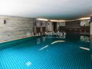 modern indoor swimming pool with tiled walls and ambient lighting