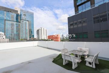 Rooftop with cityscape view and outdoor seating