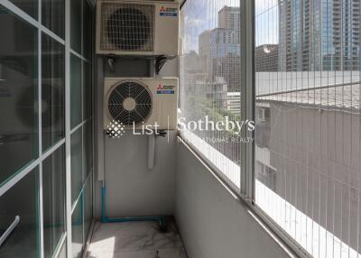 A balcony featuring air conditioning units