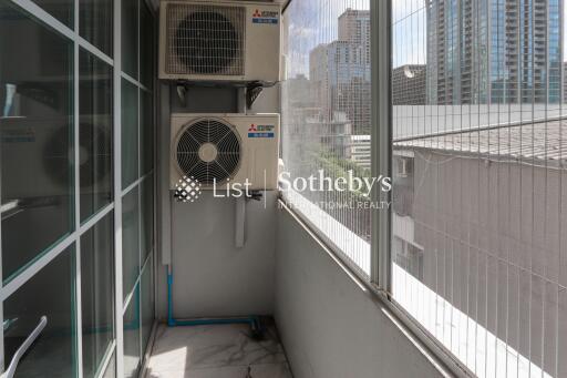 A balcony featuring air conditioning units