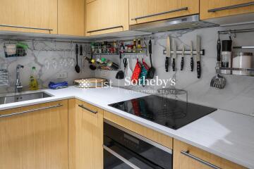 Modern kitchen with wooden cabinets and white countertops