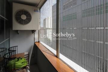 Balcony with air conditioning unit and safety mesh